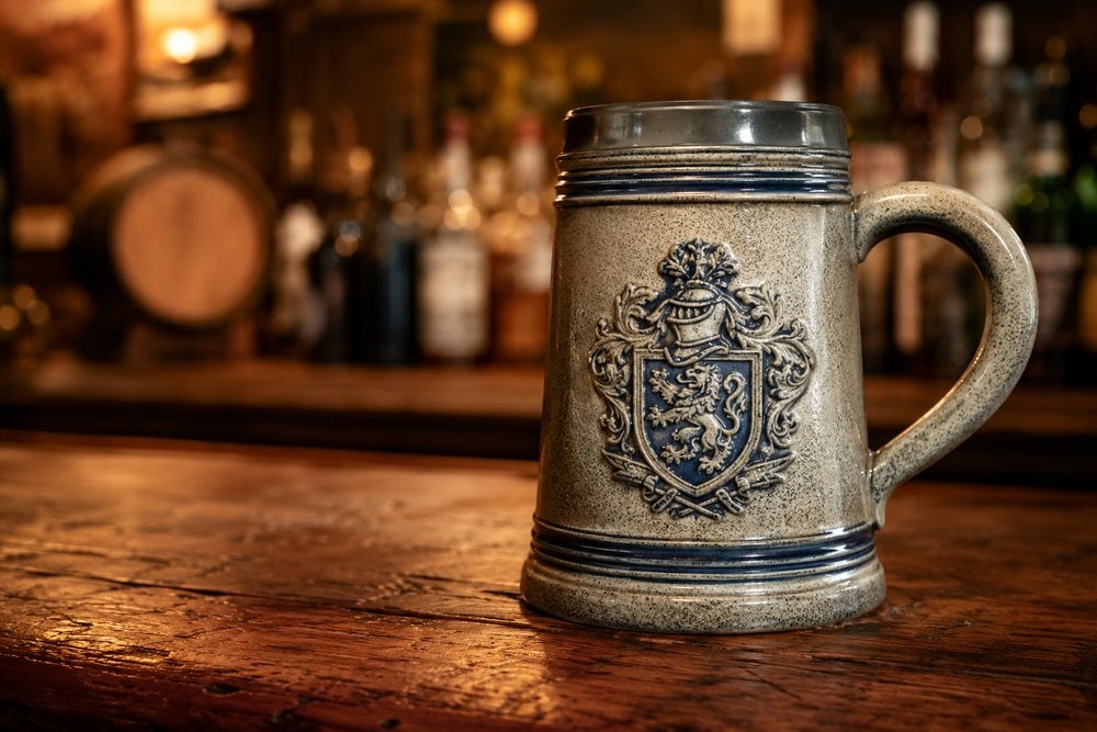 Crested stoneware steins